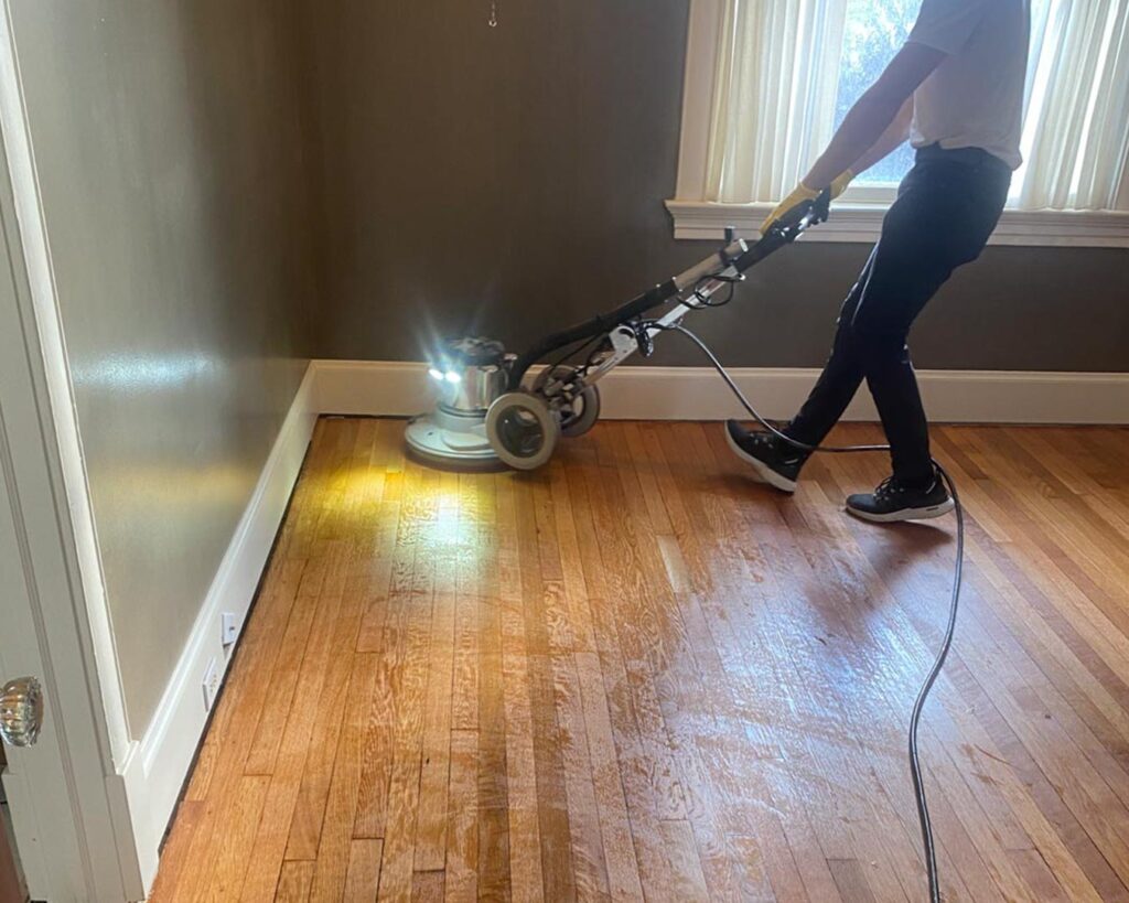 Maintenance coat being applied to hardwood flooring.